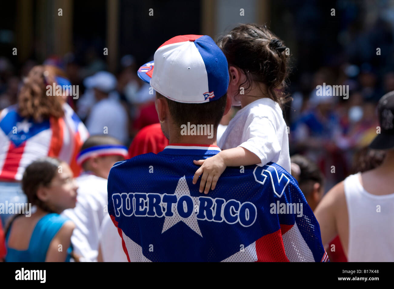 A father holds his daughter at the 2008 Puerto Rican day parade in Manhattan NY. Stock Photo