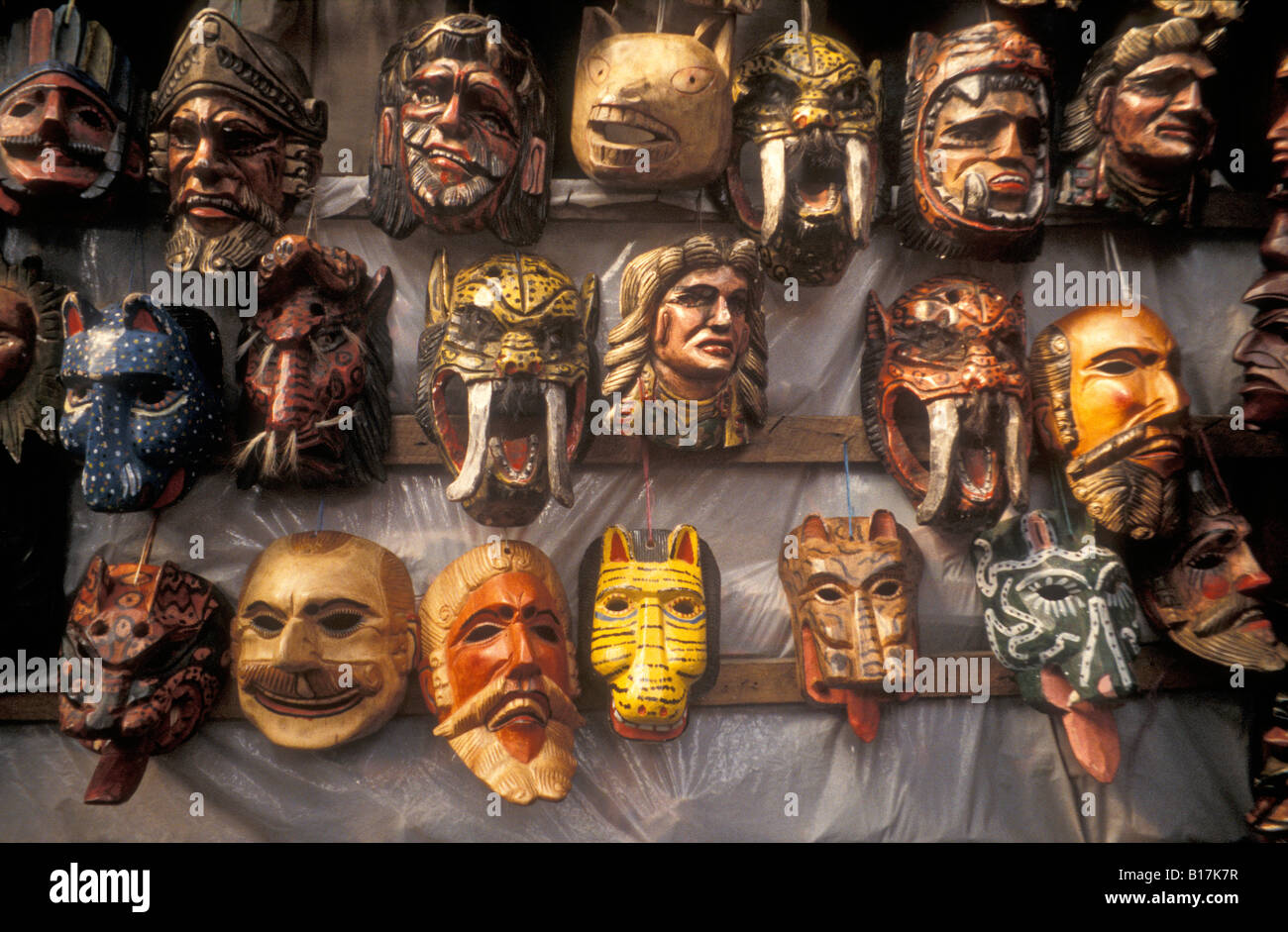 Wooden ceremonial masks for sale in the handicrafts market in Antigua, Guatemala Stock Photo
