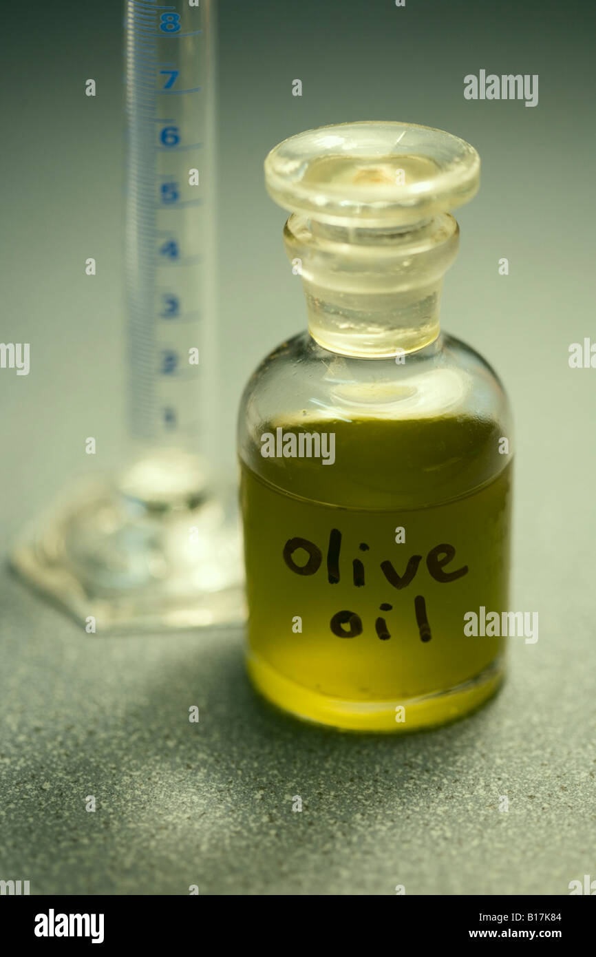 Olive oil in small glass bottle Sample taken from organically grown