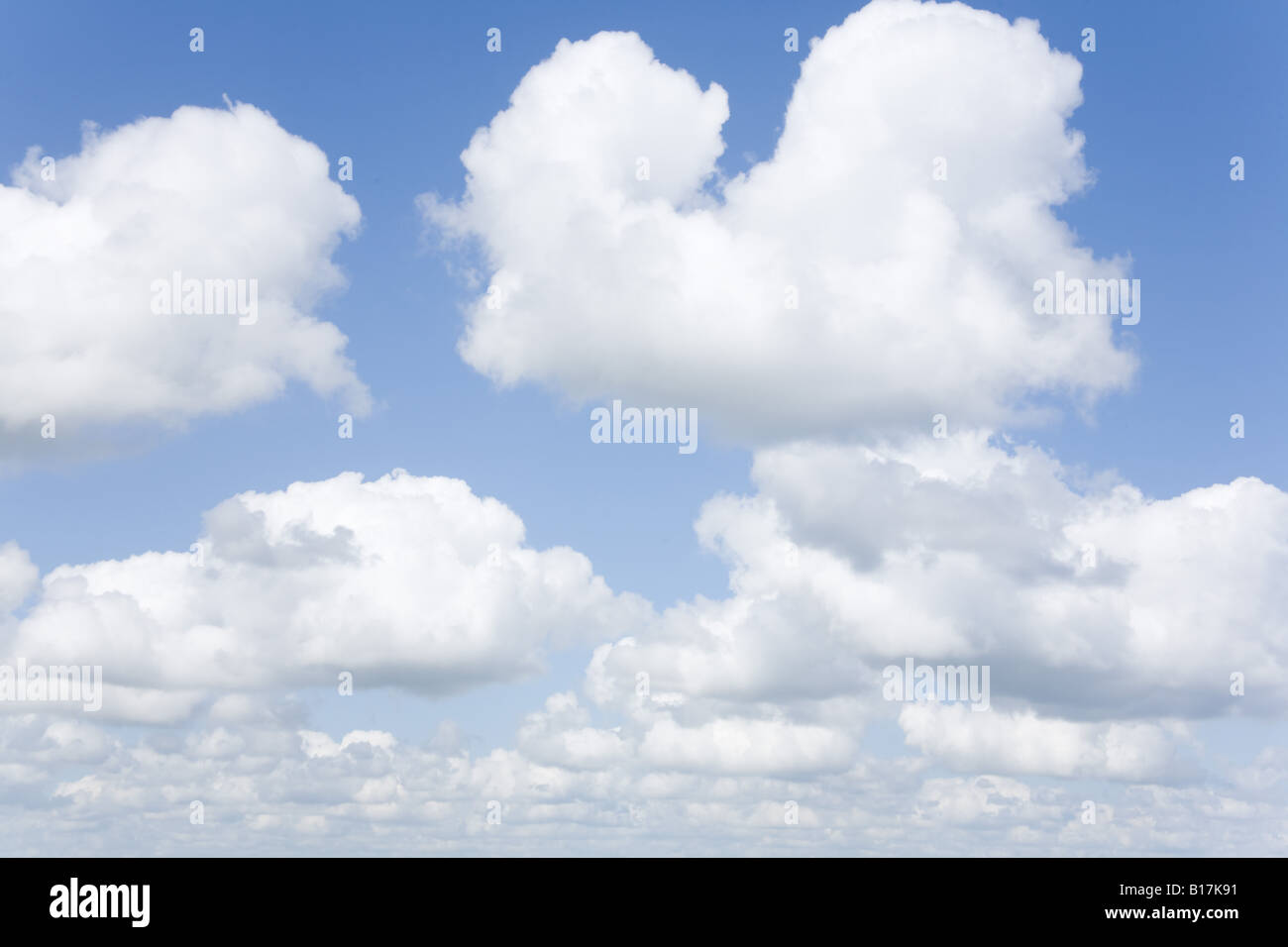 Blue sky with fluffy cumulus clouds Stock Photo - Alamy
