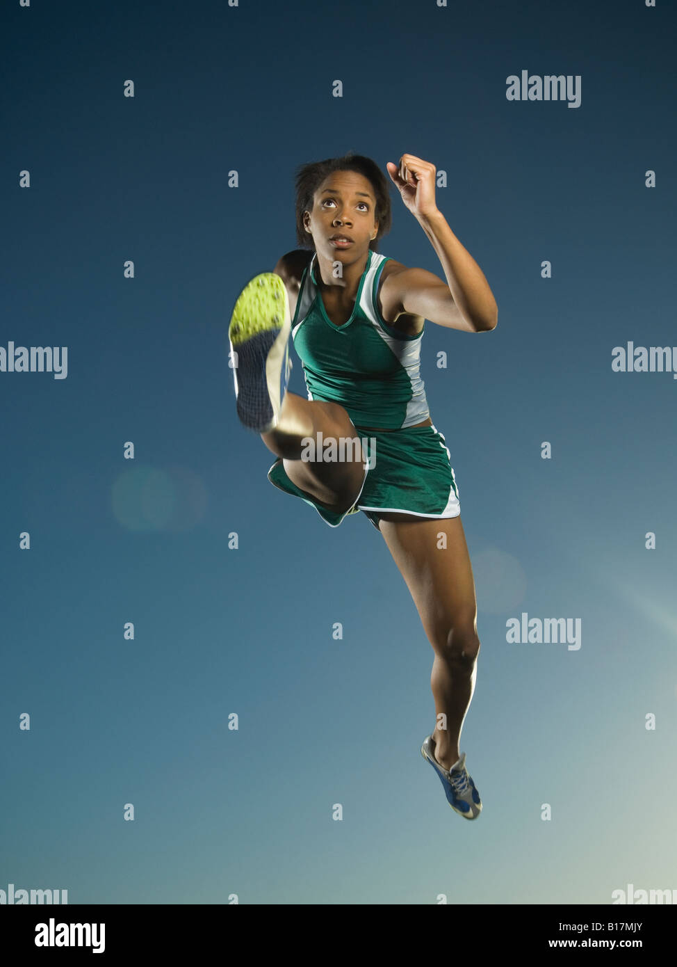 African American female athlete jumping Stock Photo