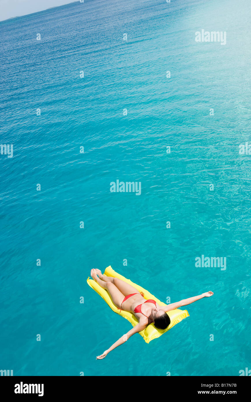 Woman on float in water Stock Photo Alamy