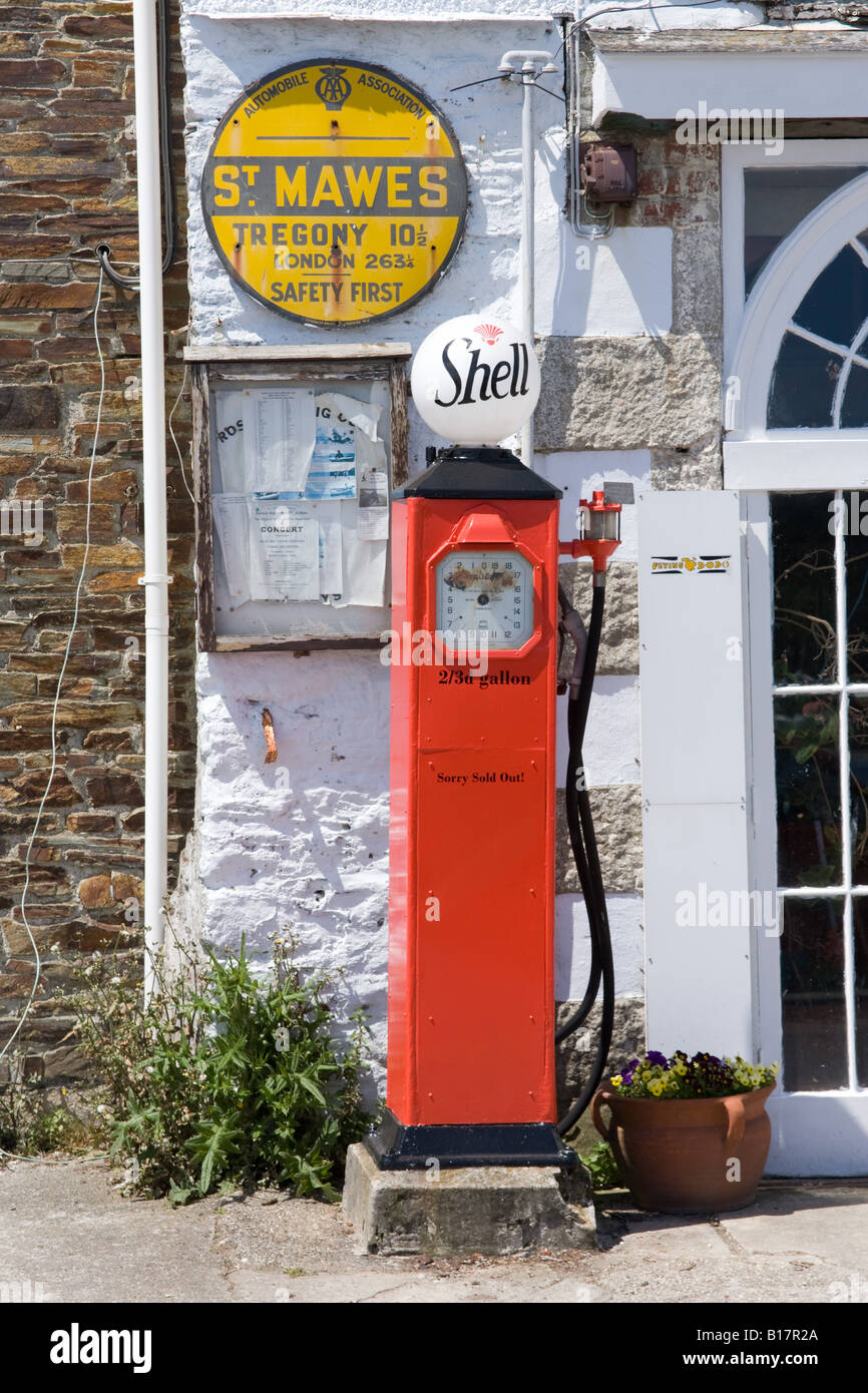 Shell petrol pump and AA mileage sign, St Mawes Harbour Cornwall England. Stock Photo