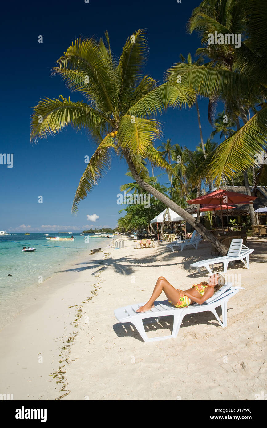 relaxing on the Alona Beach Panglao Island Bohol Philippines Stock Photo