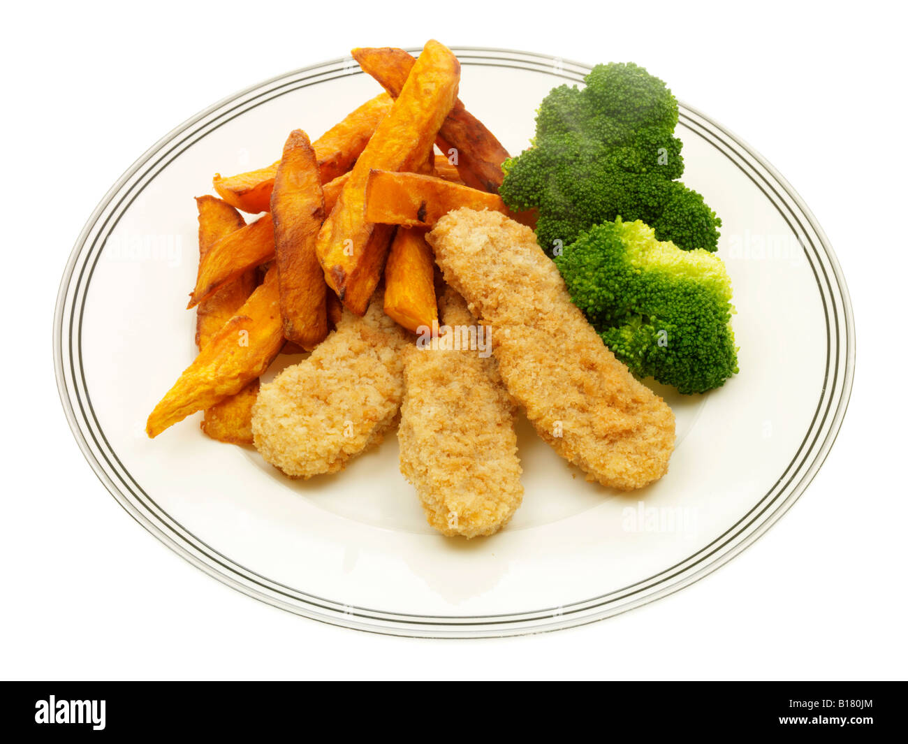 Breaded Chicken Strips with Sweet Potato Chips and Broccoli Stock Photo