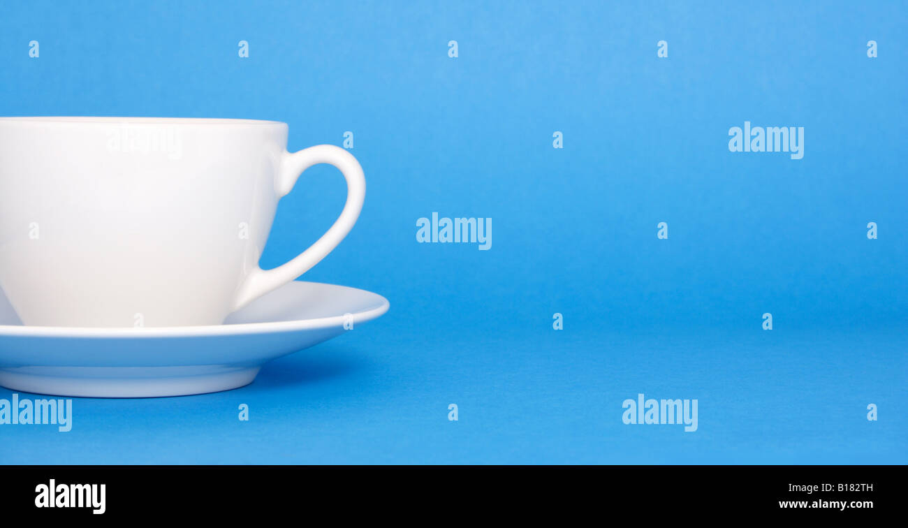 A cup of coffee on blue background Stock Photo - Alamy