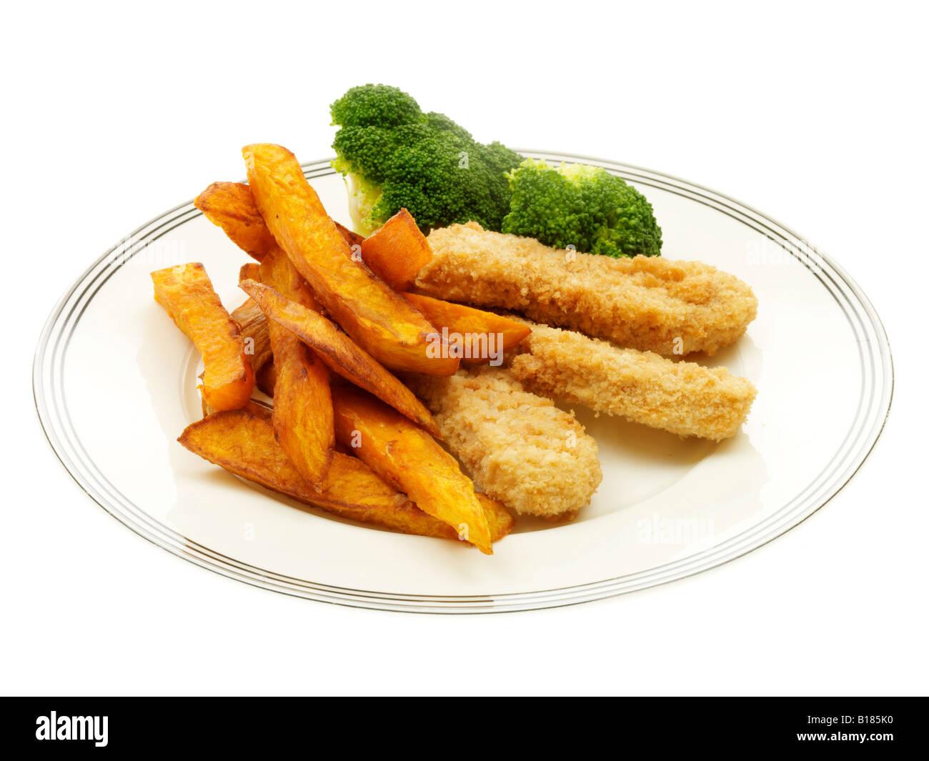 Breaded Chicken Strips with Sweet Potato Chips and Broccoli Stock Photo