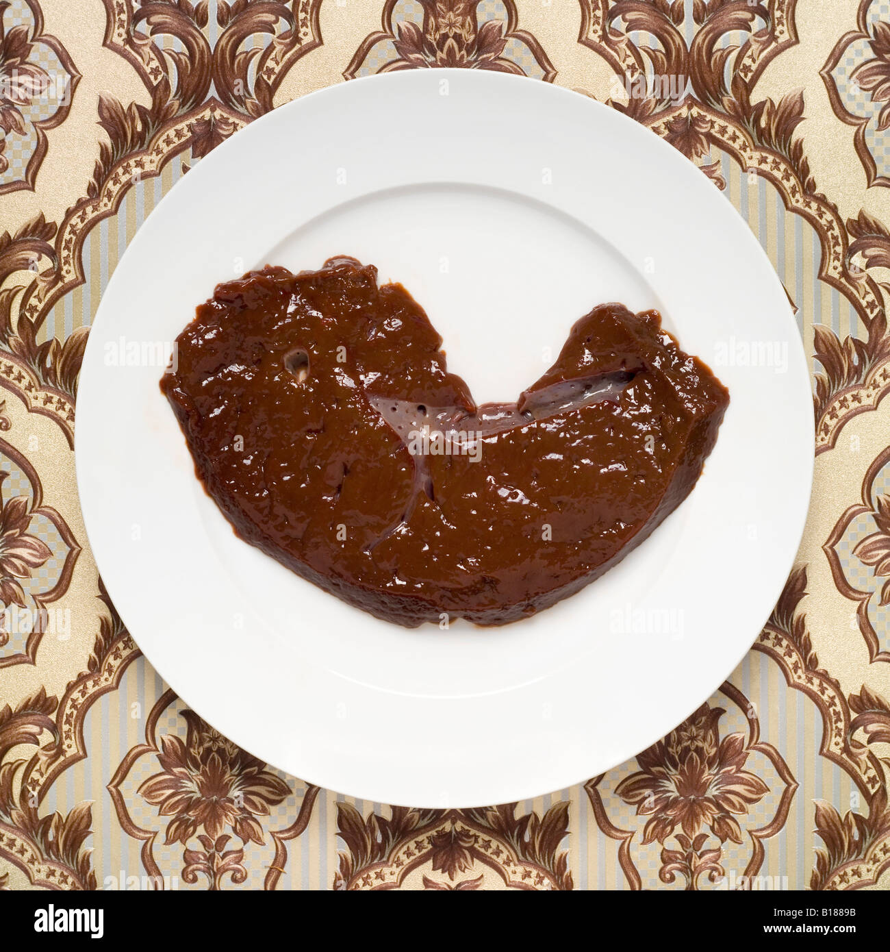 Raw calf liver on plate, elevated view Stock Photo Alamy