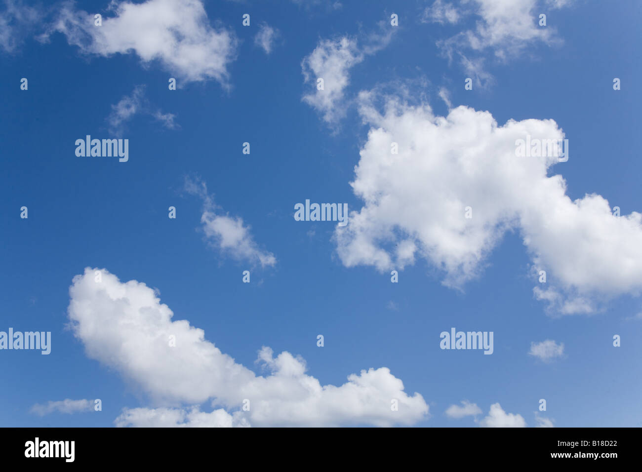 Blue sky with fluffy cumulus clouds Stock Photo - Alamy