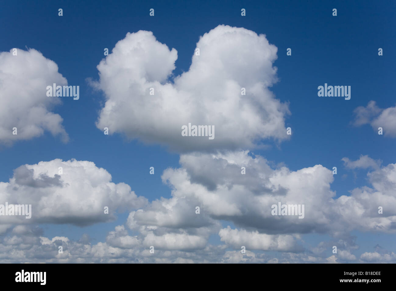 Blue sky with fluffy cumulus clouds Stock Photo - Alamy
