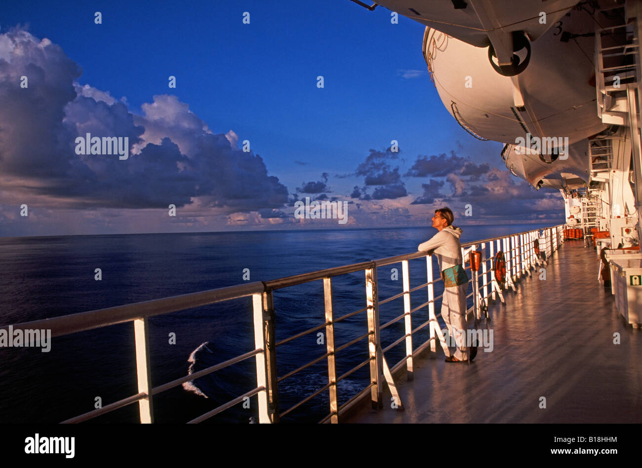 Woman on cruise ship deck in the Indian Ocean Stock Photo