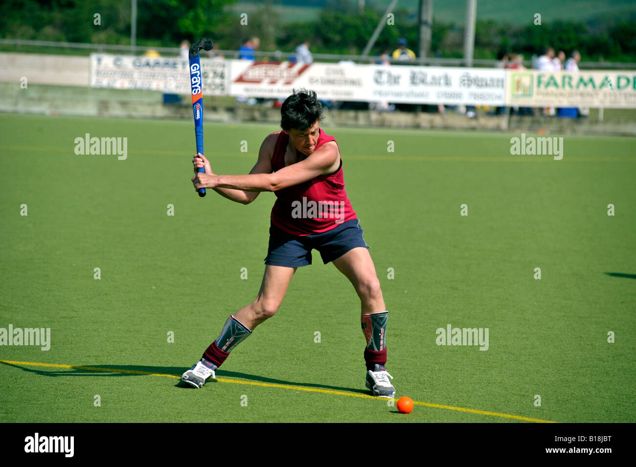 women hitting hockey ball Stock Photo Alamy