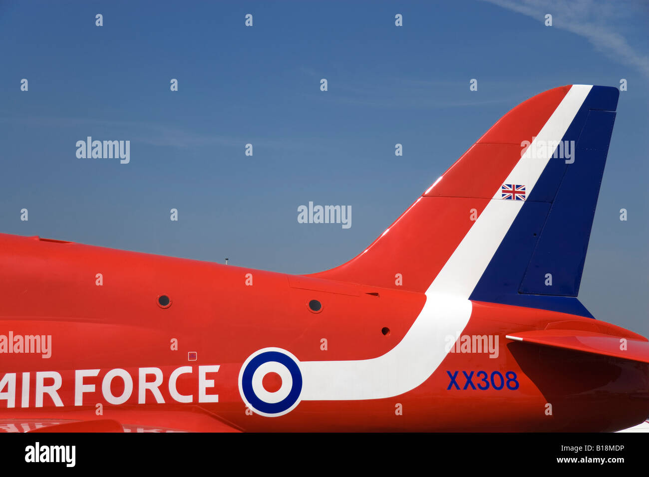 Red white and blue upper fuselage and tail of a BAE Systems Hawk aircraft of the Royal Air Force s Red Arrows Display Team Stock Photo