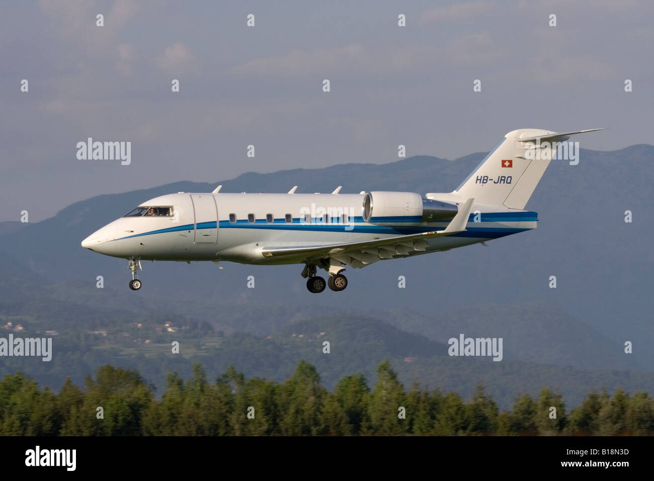 Bombardier Challenger 604 private jet arriving at Ljubljana Airport. Executive air transport. Stock Photo