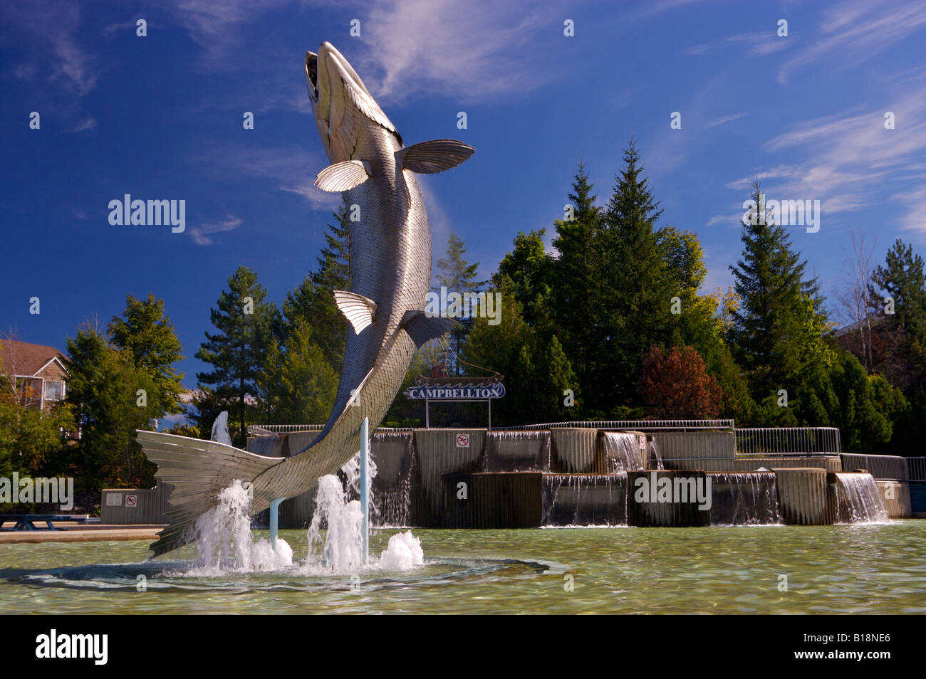 Monument of an Atlantic Salmon (8.5 metres high) named Restigouche Sam, along the waterfront of the Restigouche River in the tow Stock Photo