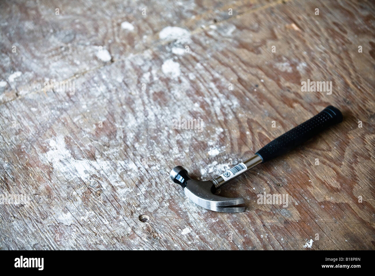 Hammer on an unfinished floor Stock Photo Alamy