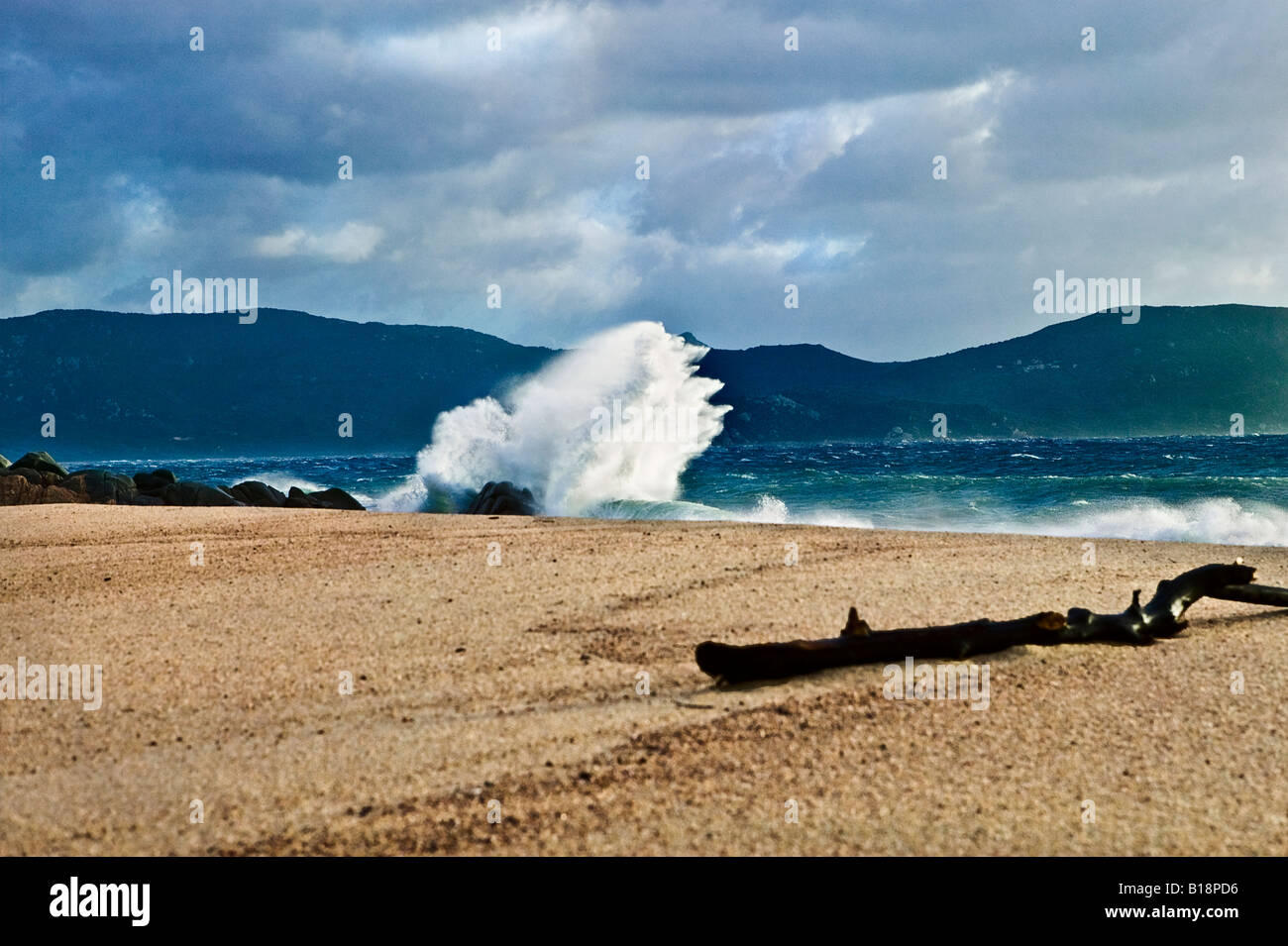 Shooting Rocks Beach Wave striking rocks on beach Stock Photo - Alamy