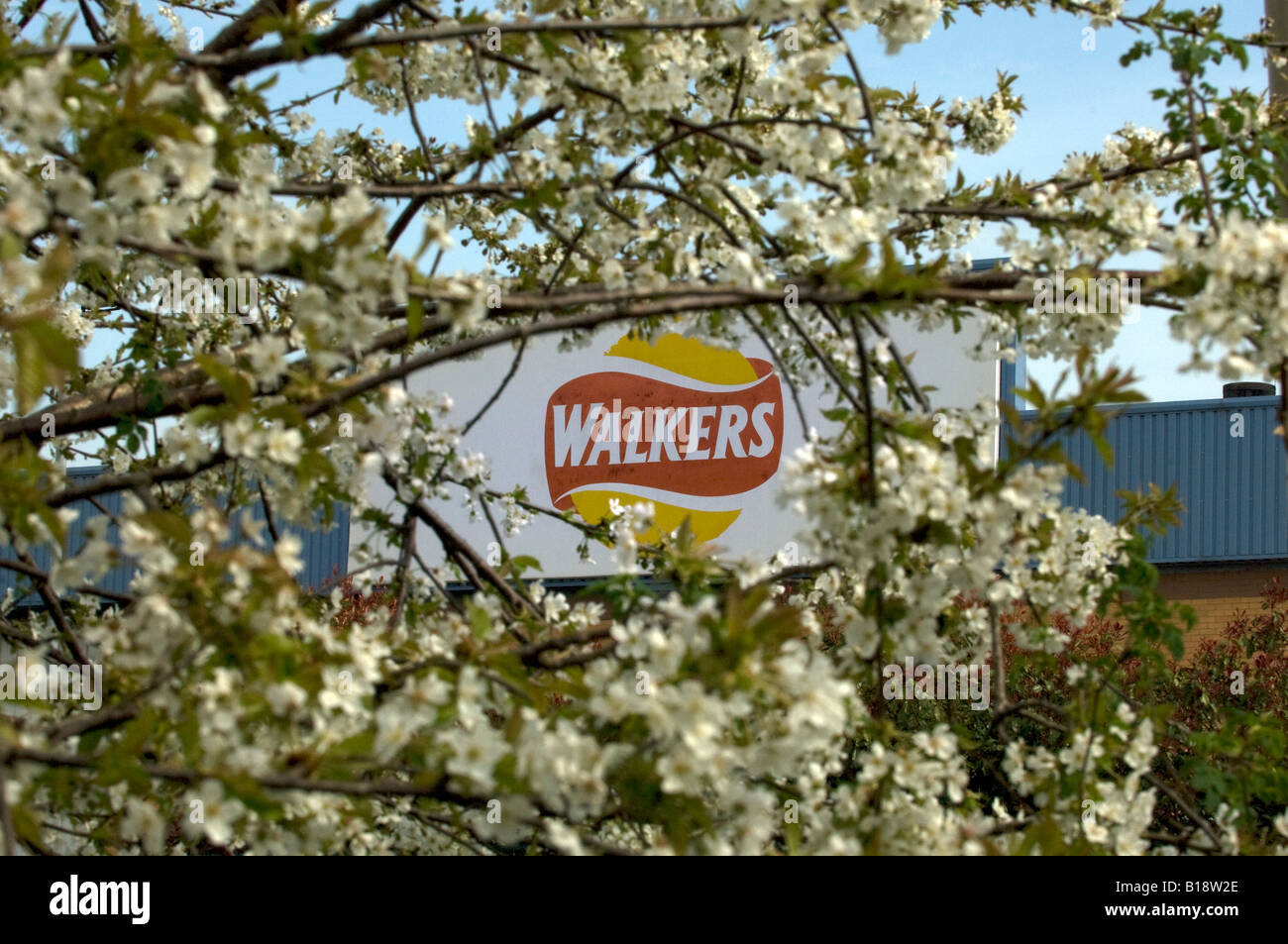 The Walkers Crisp snack food sign logo on the corporate factory and company headquarters HQ in Beaumont Leys Leicester Stock Photo