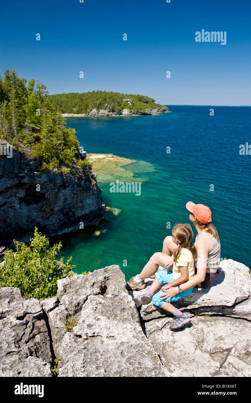 Young mother and daughter enjoy view at The Grotto along Bruce Trail, Bruce Penninsula National Park, near Tobermory, Ontario, C Stock Photo