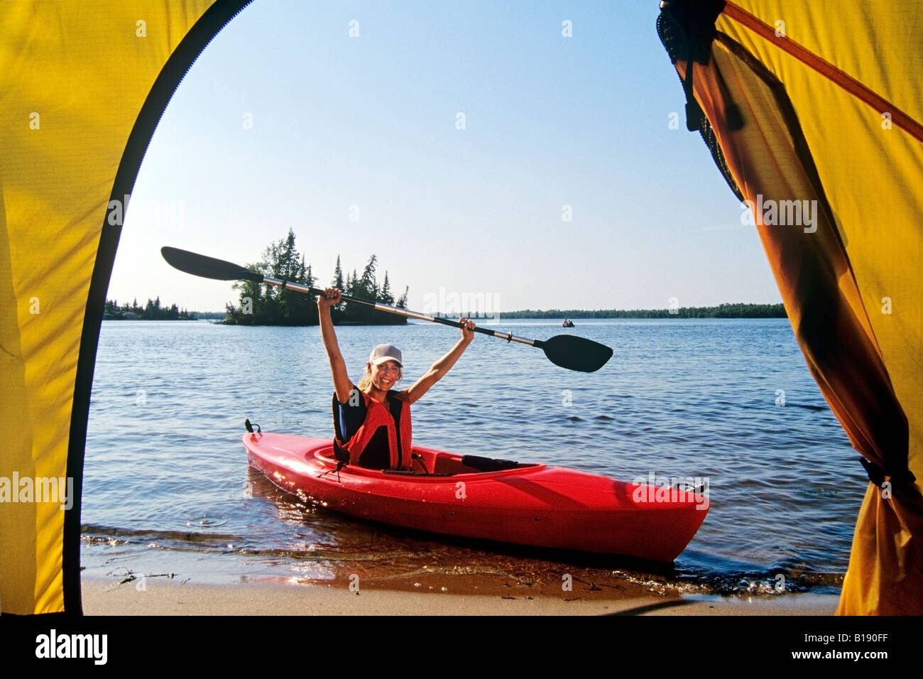 Female with kayak at Otter Falls campground, Whiteshell Provincial Park
