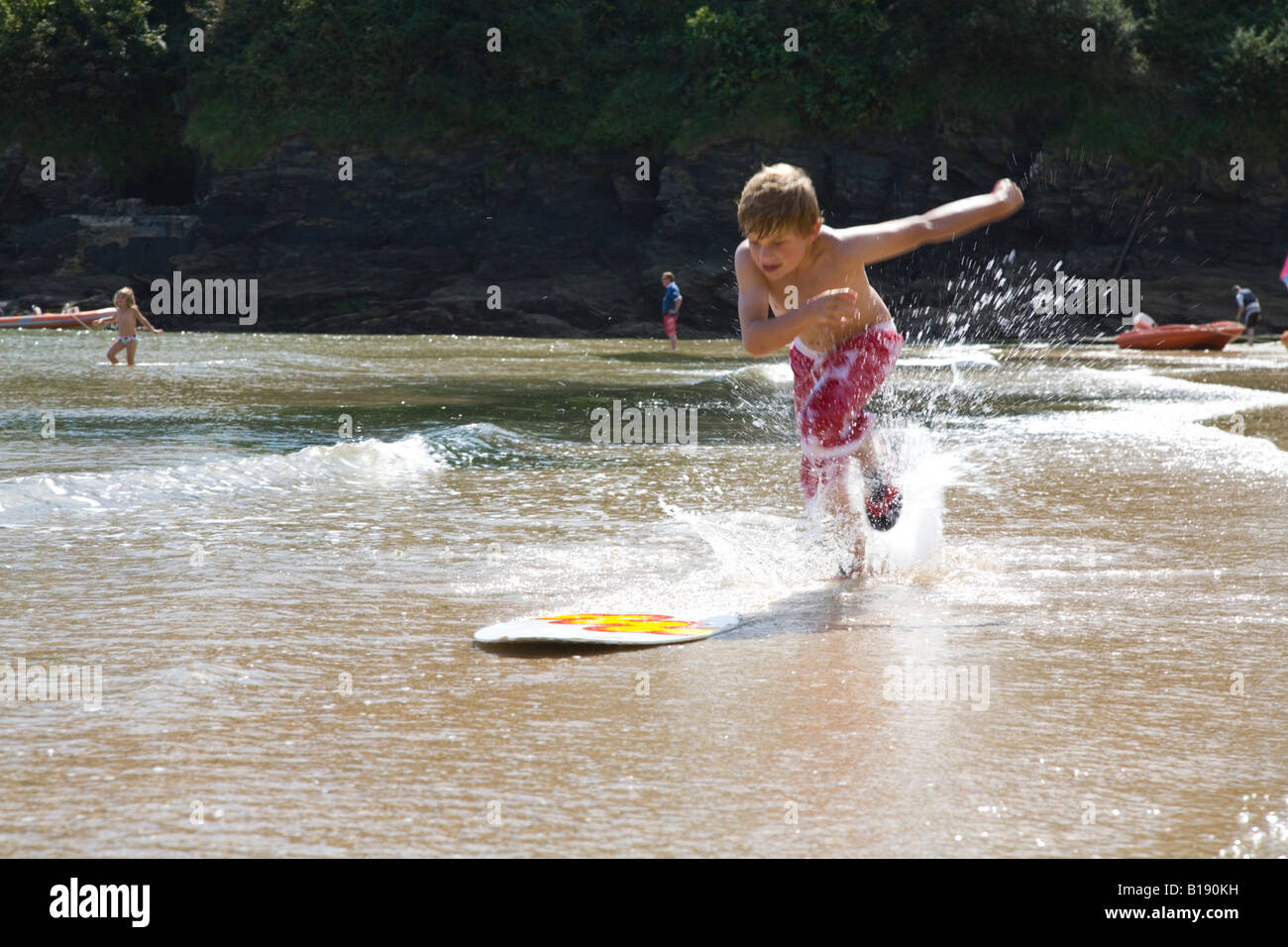 boy playing in the sea Stock Photo - Alamy