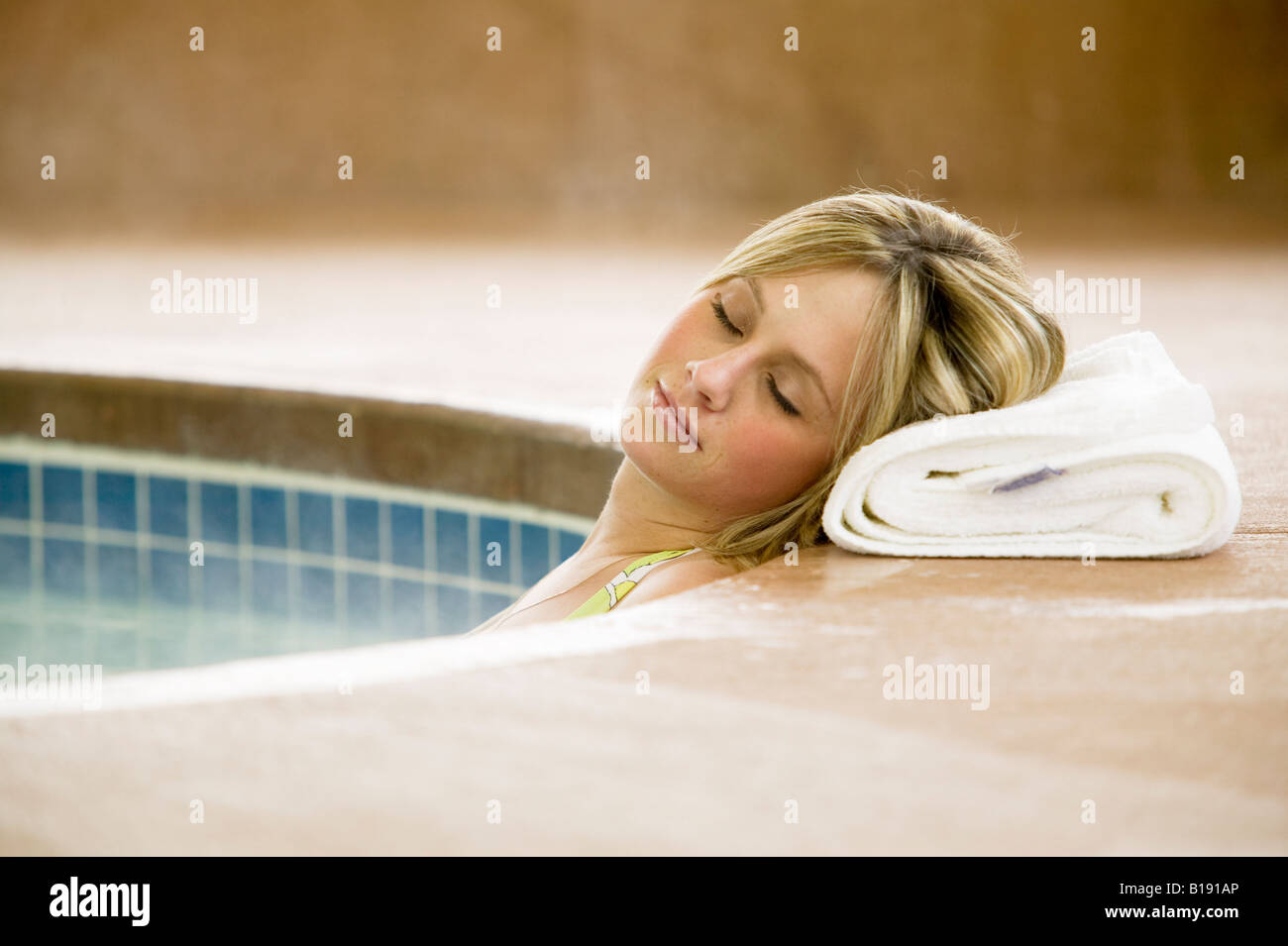 Woman relaxes in hot tub port alberni hires stock photography and