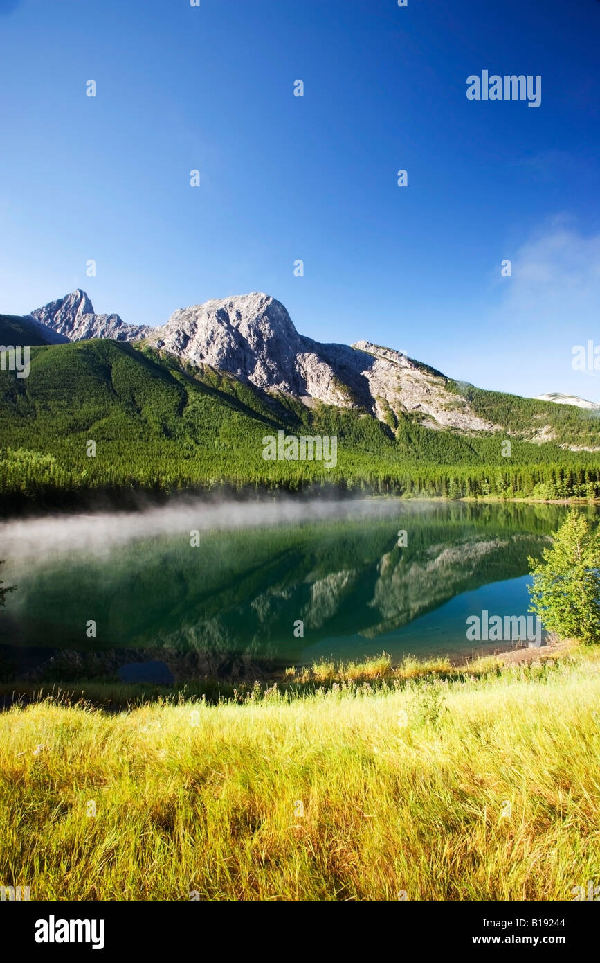 Mount Kid reflected in Wedge Pond, Kananaskis Provincial Park, Alberta, Canada. Stock Photo