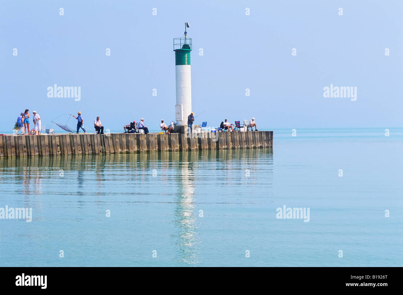 People fishing on wharf, Port Bruce, Lake Erie, Ontario, Canada. Stock Photo