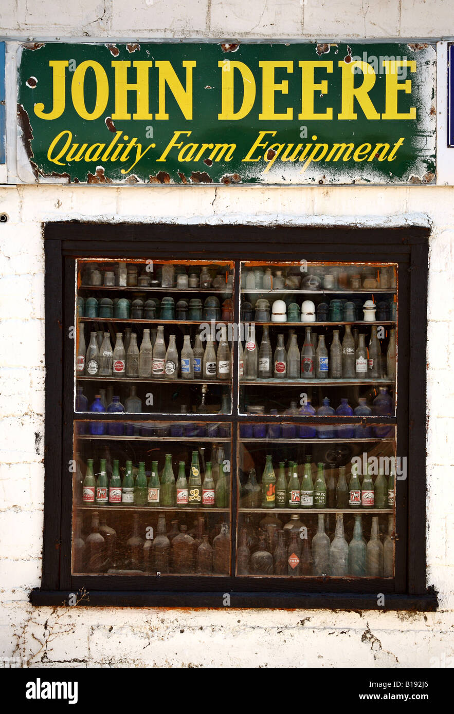 Antique bottles in store window of Eyebrow Saskatchewan Stock Photo Alamy