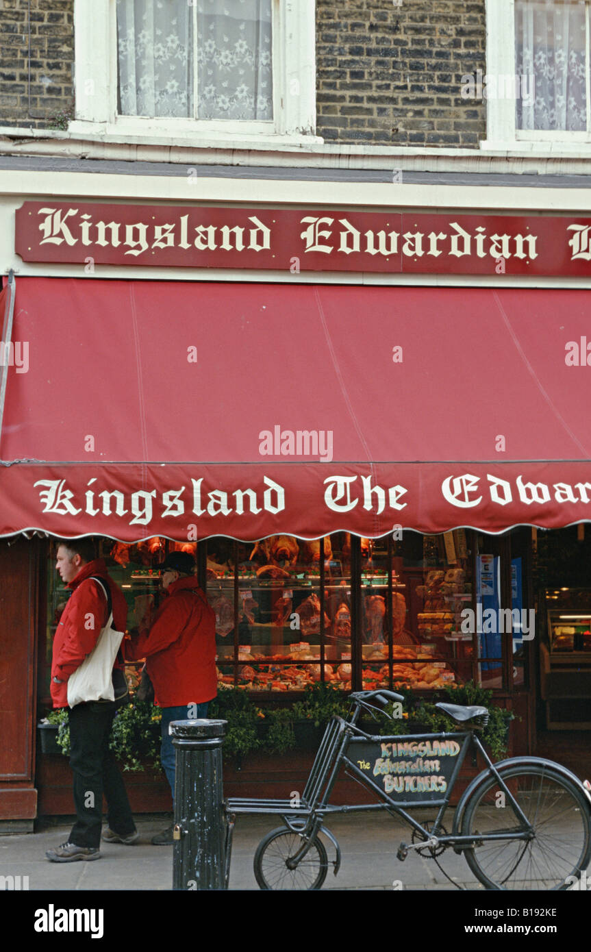 GREAT BRITAIN London Kingsland Edwardian butcher shop in Portobello market area red awning old fashioned bicycle Stock Photo