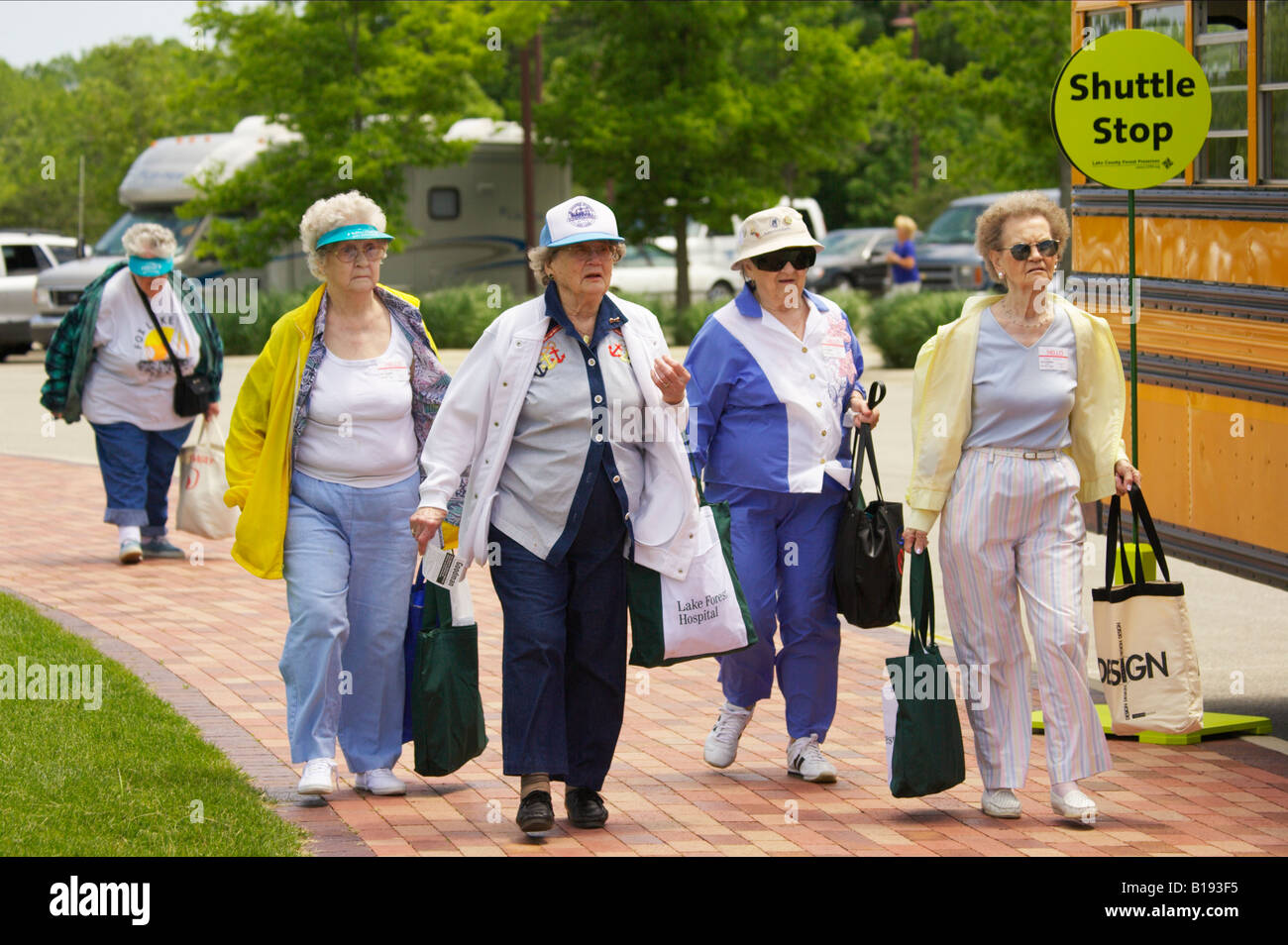 events-libertyville-illinois-four-senior-ladies-with-shopping-bags-B193F5.jpg
