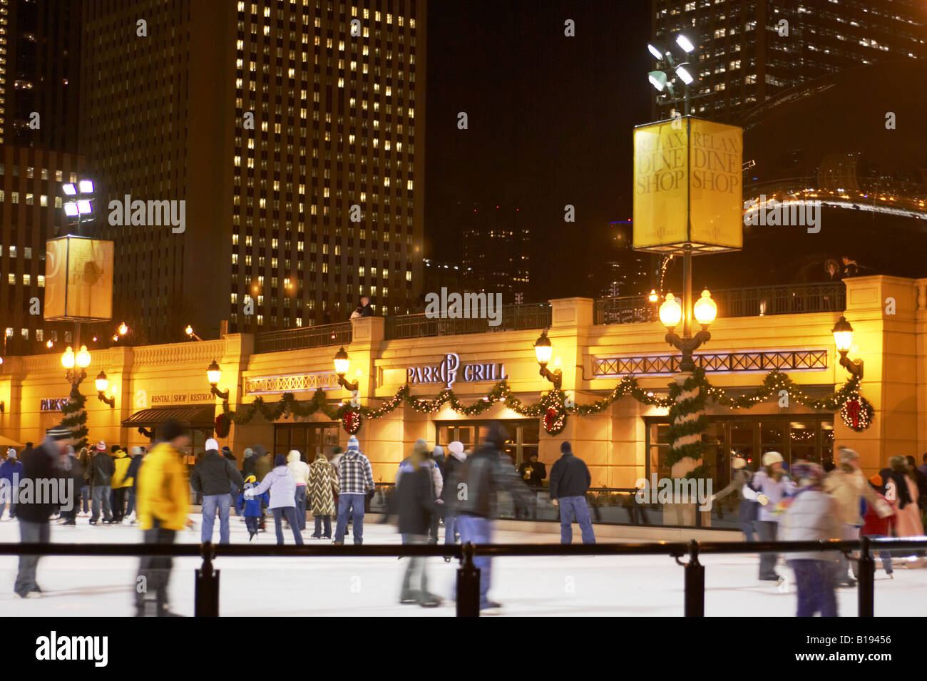 SKATING Chicago Illinois Ice skaters at Millennium Park ice rink winter