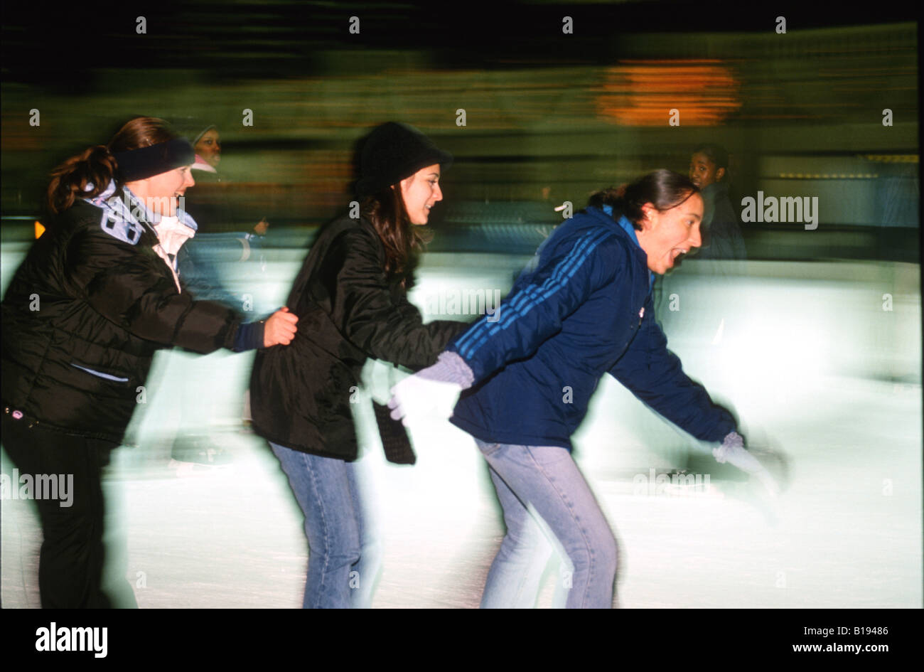 SKATING Chicago Illinois Ice skaters at Millennium Park ice rink winter