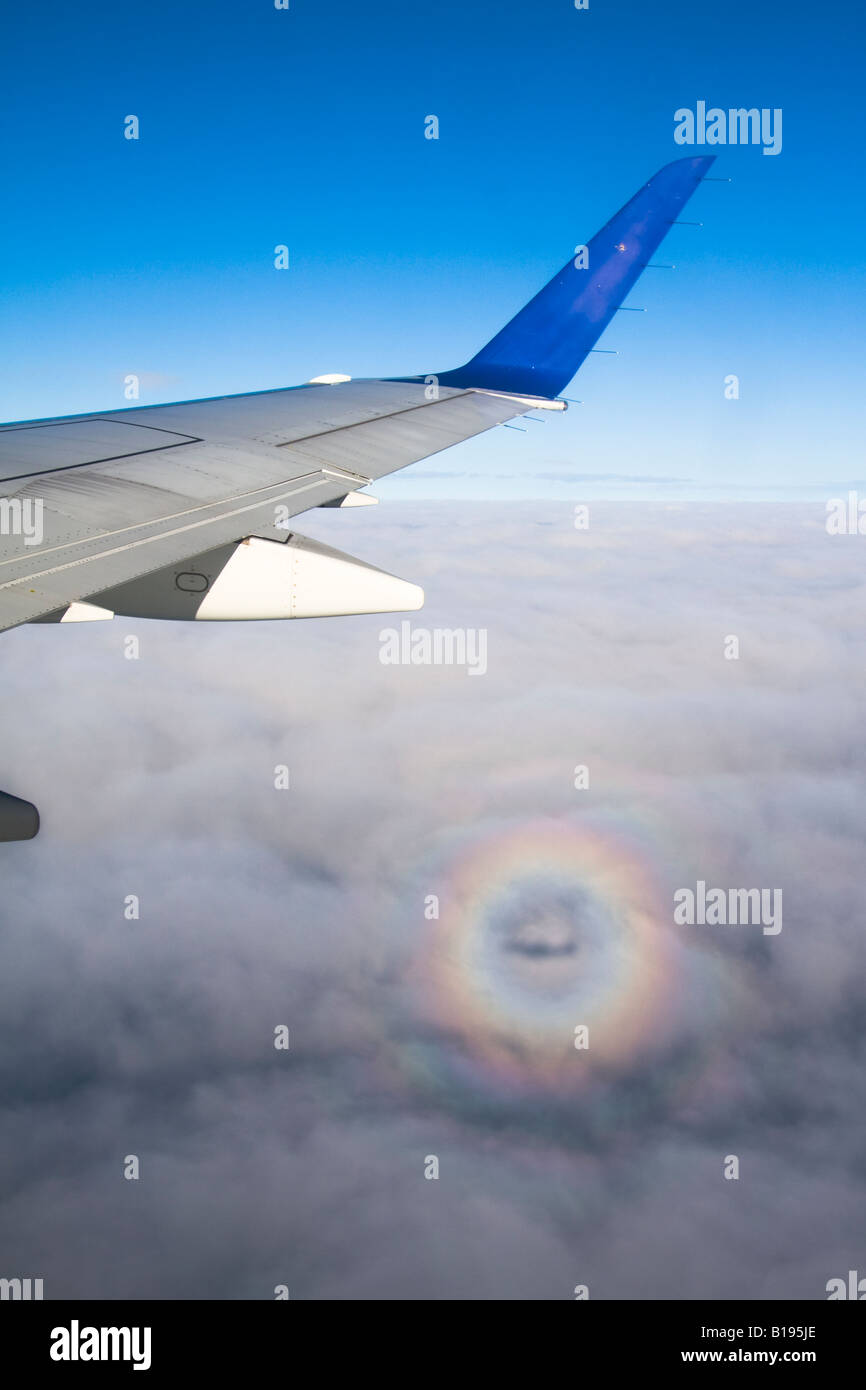 The Glory of the Pilot circular rainbow with the plane s shadow in the centre of the circle Stock Photo