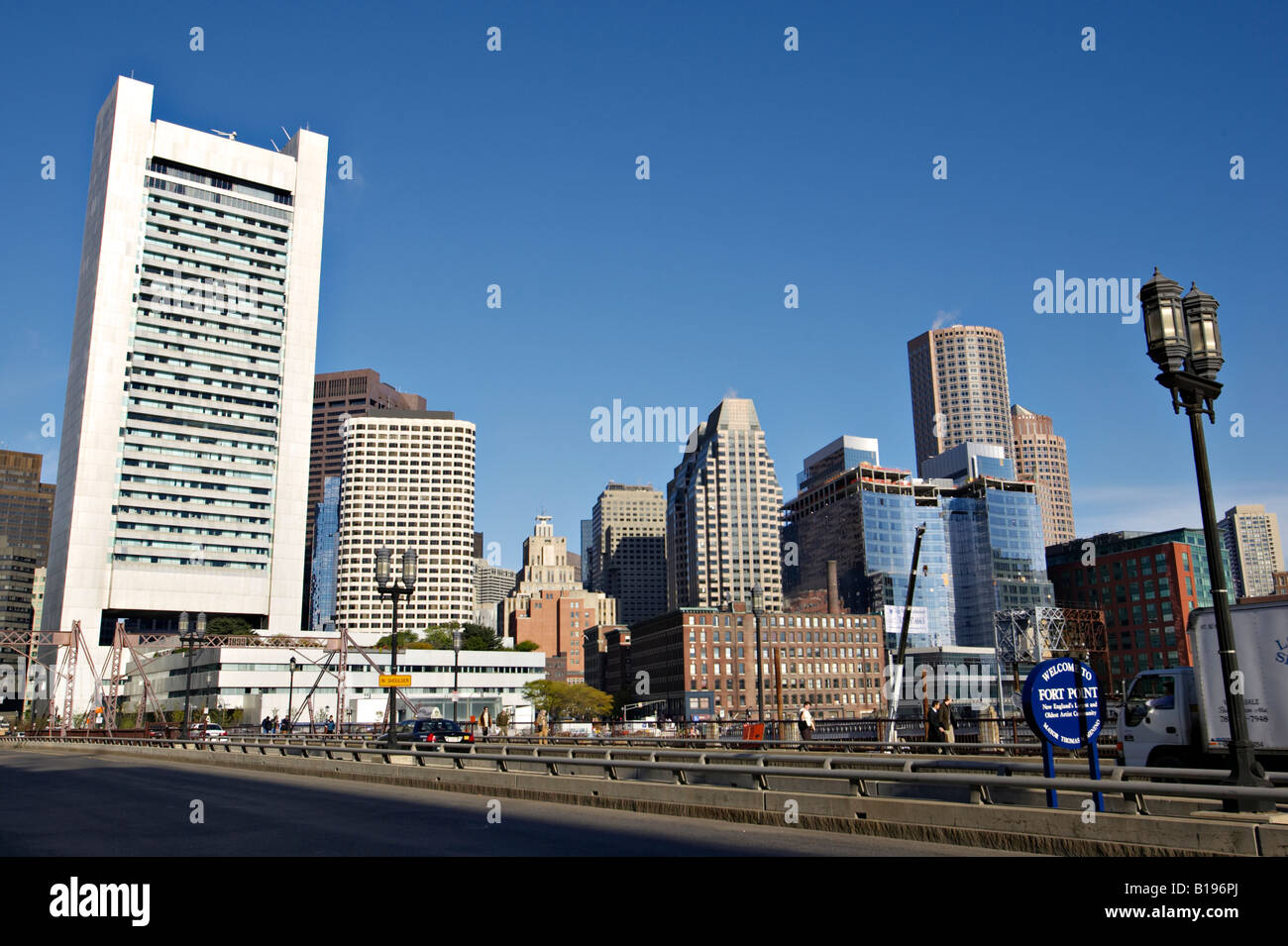 MASSACHUSETTS Boston Federal Reserve Bank building near Boston Harbor and South Station bridge skyline welcome sign Fort Point Stock Photo