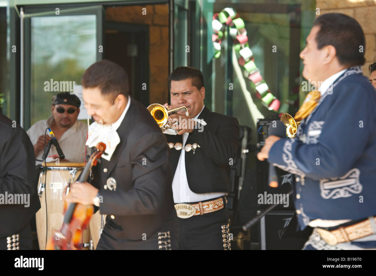 MUSIC North Chicago Illinois Hispanic man play trumpet violin percussion player and singer Stock Photo