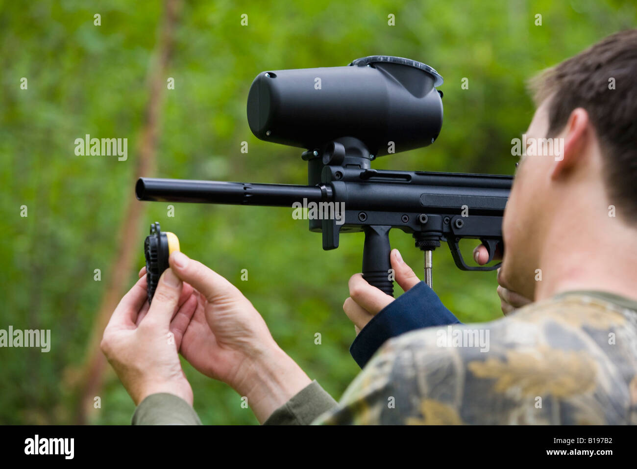 Man loading paintball gun Stock Photo Alamy