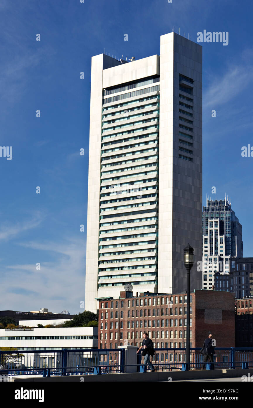 MASSACHUSETTS Boston Federal Reserve Bank building near Boston Harbor and South Station man walk across bridge Stock Photo