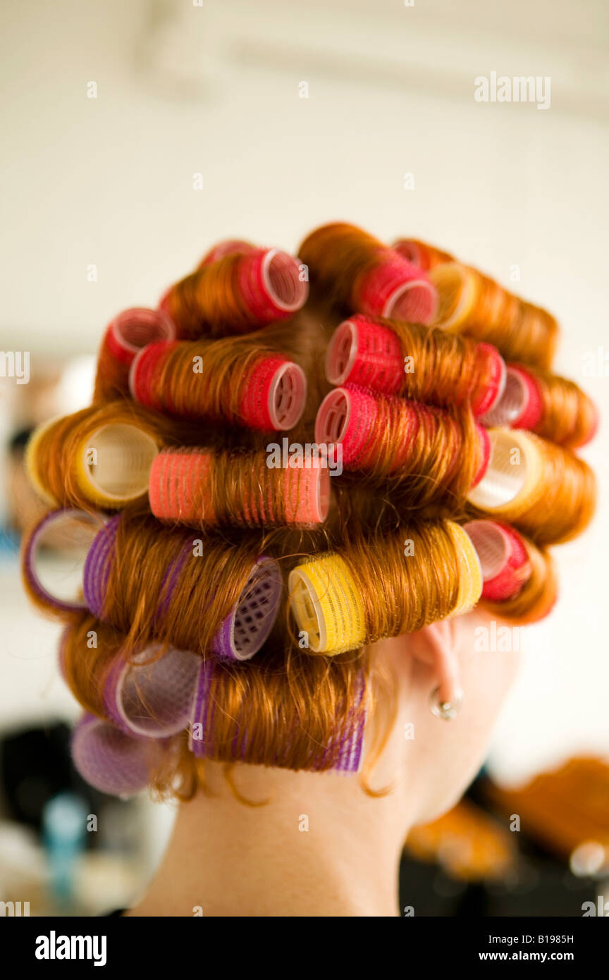 30 year old woman red hair with rollers, Montreal, Quebec, Canada Stock Photo