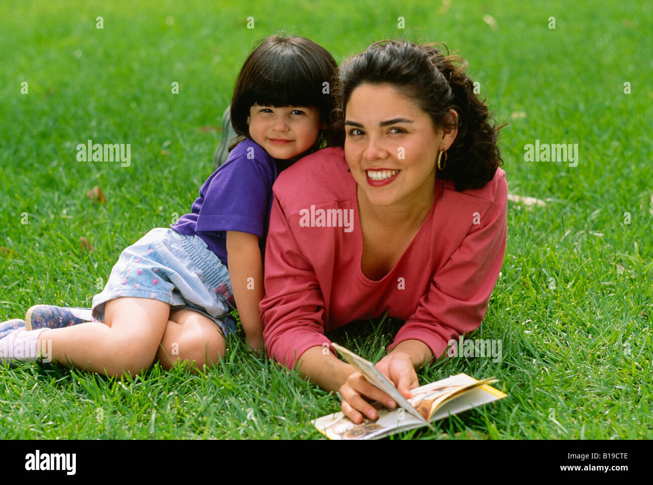 Mother with daughter at lawn latina hispanic Stock Photo