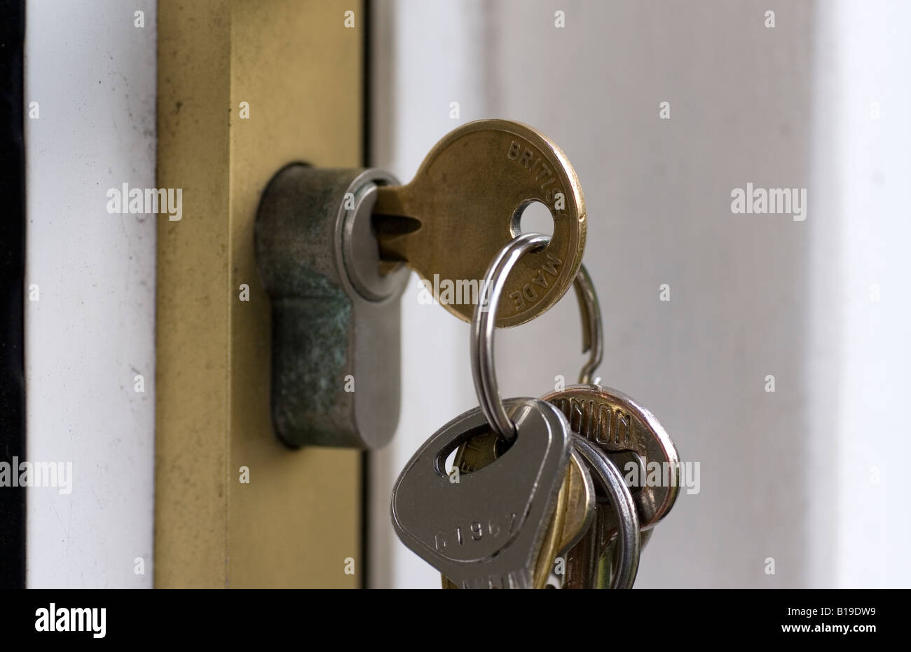 Door keys in the lock Stock Photo Alamy