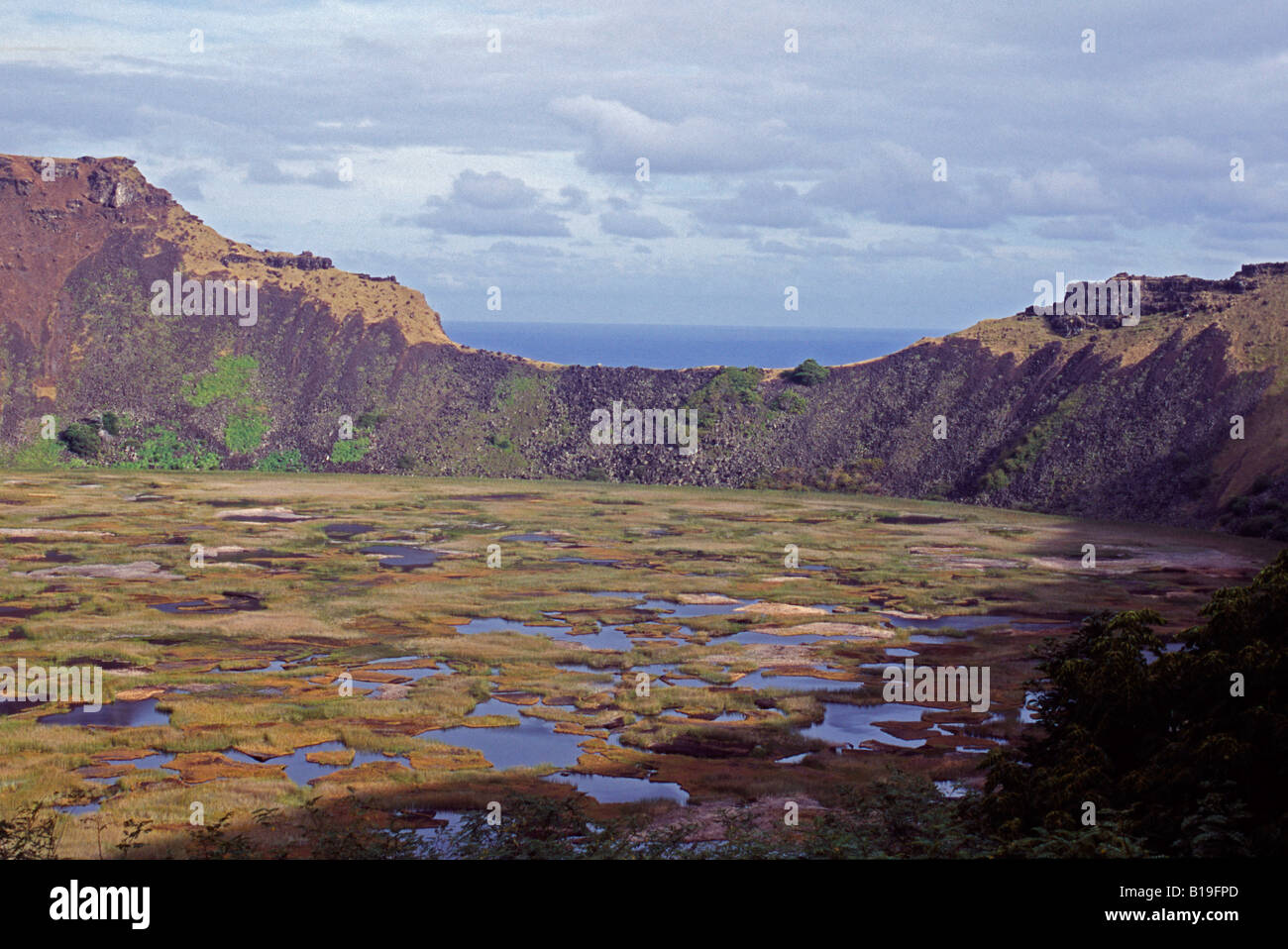 Chile, Easter Island. The rim of the crater of Rano Kau volcano at the south western tip of Easter Island. Stock Photo