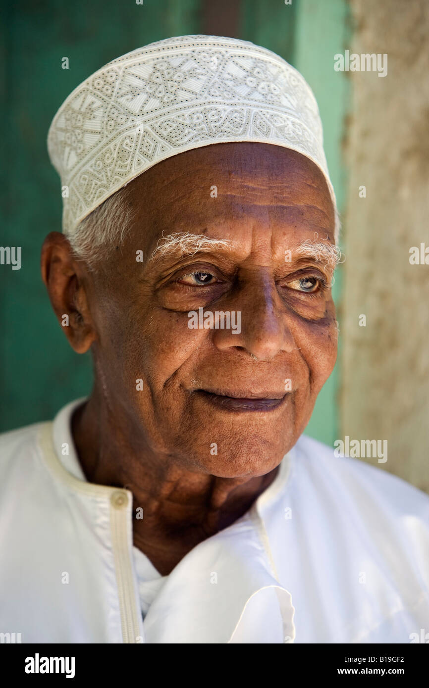 Kenya, Lamu Island, Lamu. An old resident of Lamu town dressed in his kofia or embroidered Muslim hat. Stock Photo