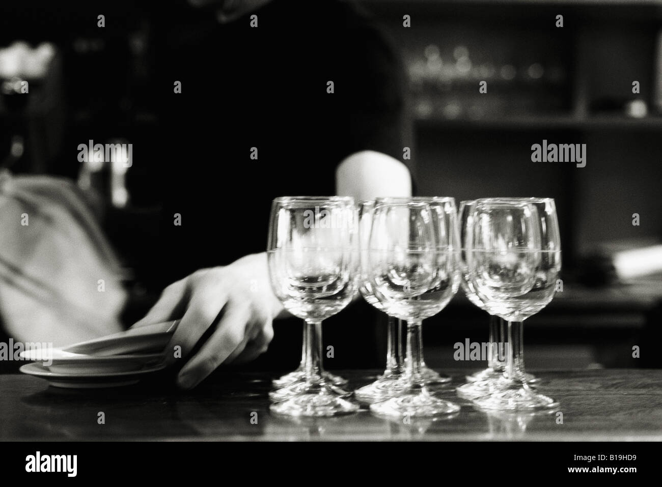 Wine glasses on counter of bar Stock Photo