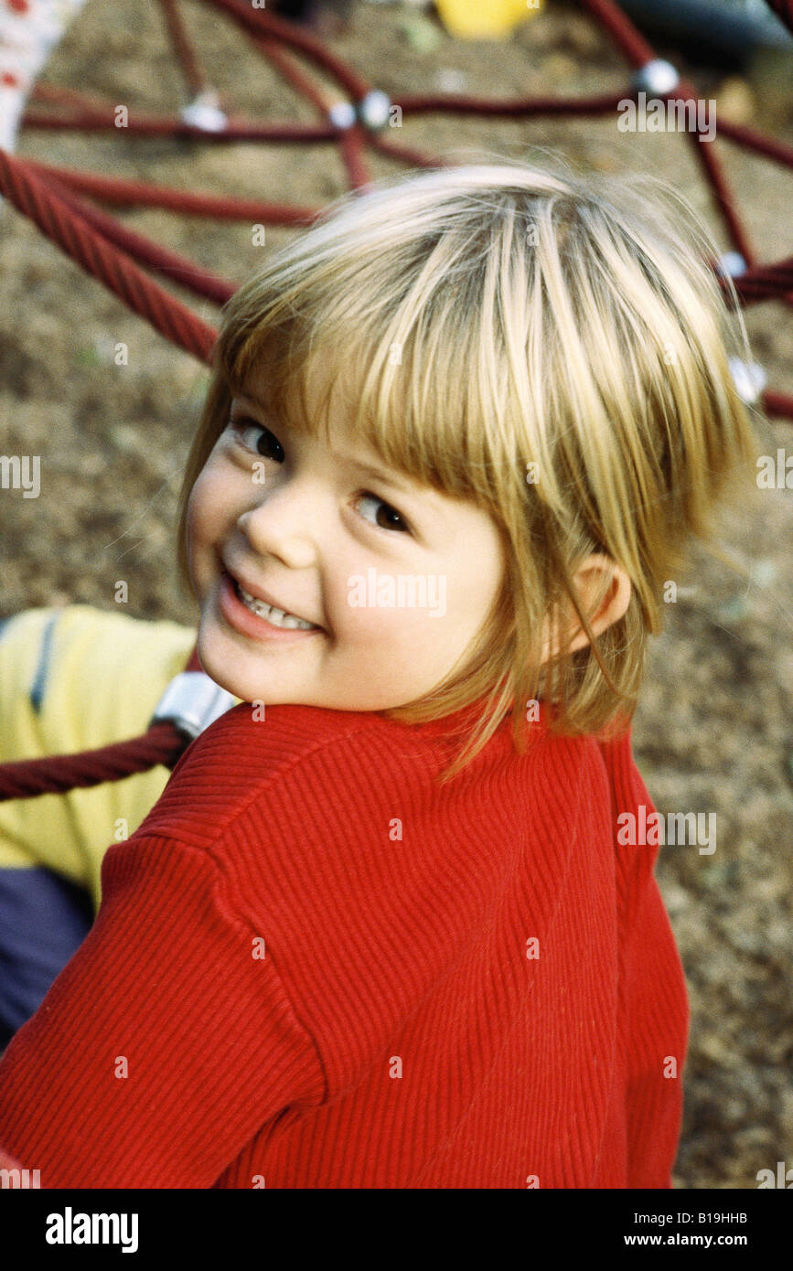 Little girl on playground, smiling at camera, portrait Stock Photo - Alamy