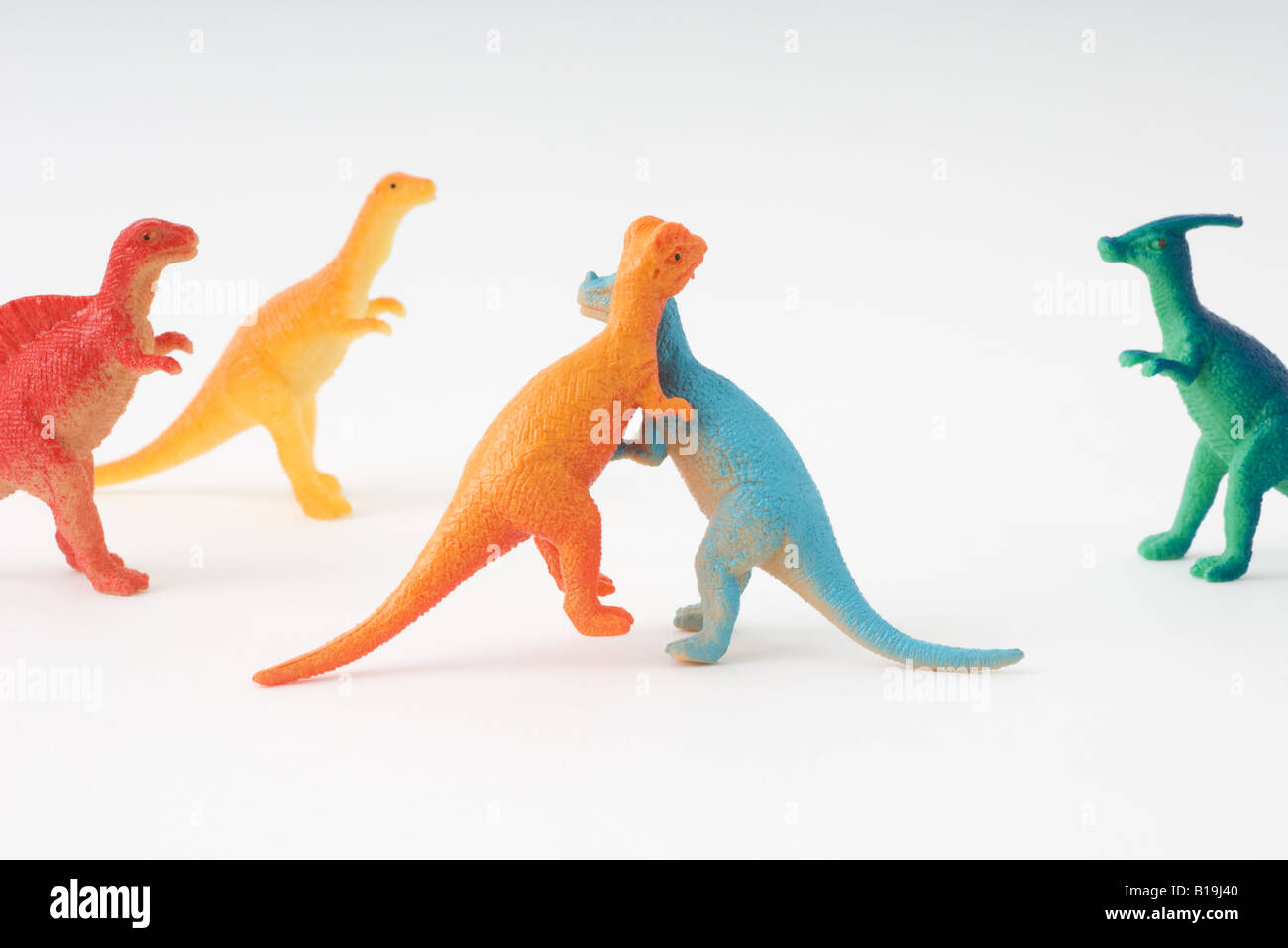 toy dinosaurs fighting