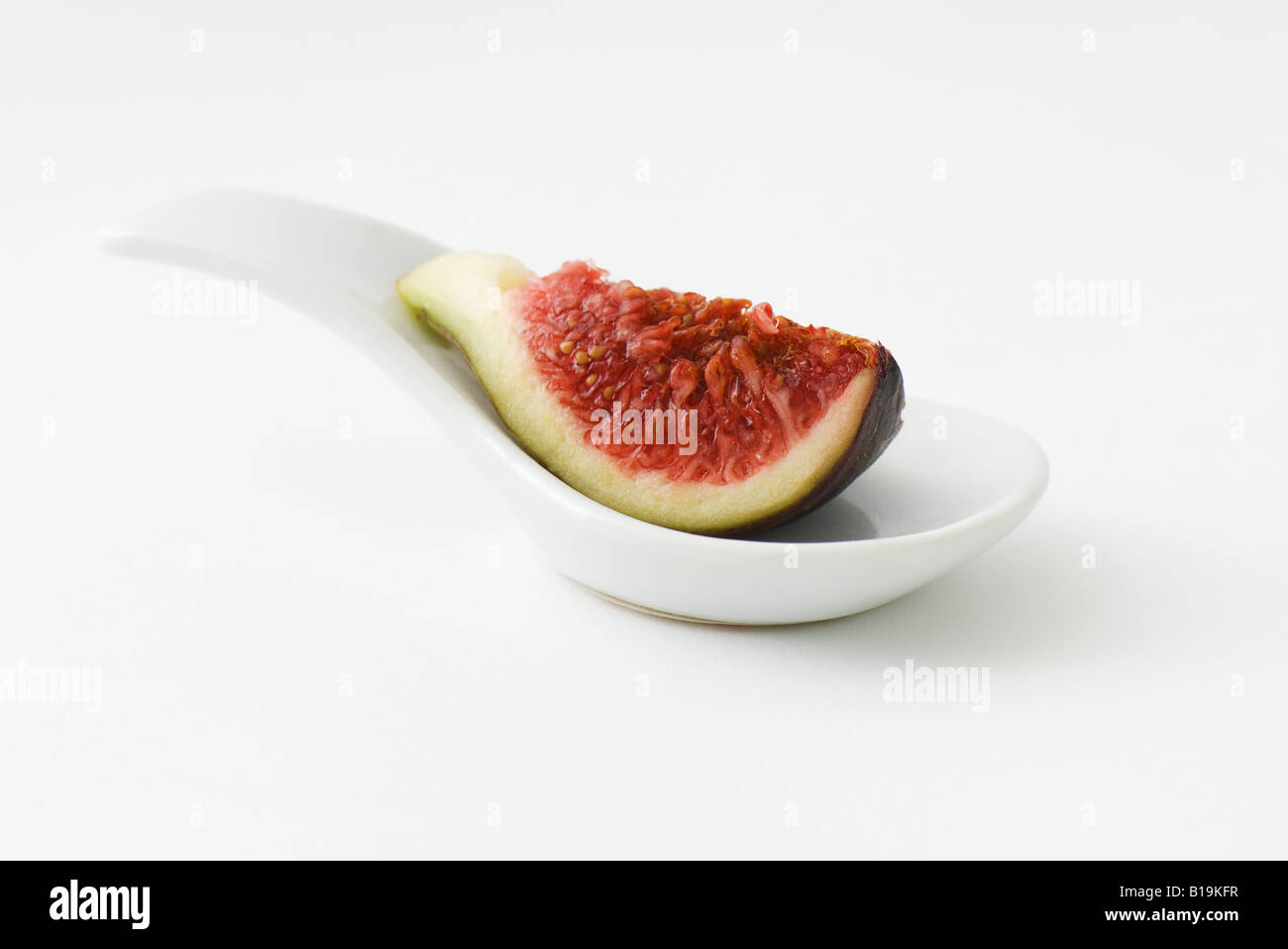 Fig slice on spoon Stock Photo