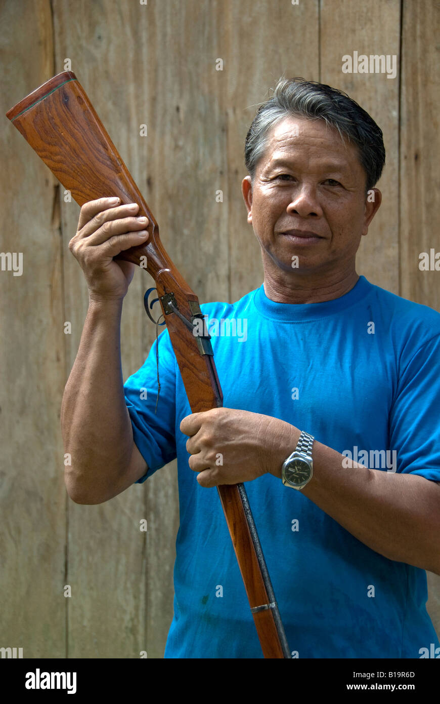 Gunsmith with a rifle he s made Stock Photo Alamy