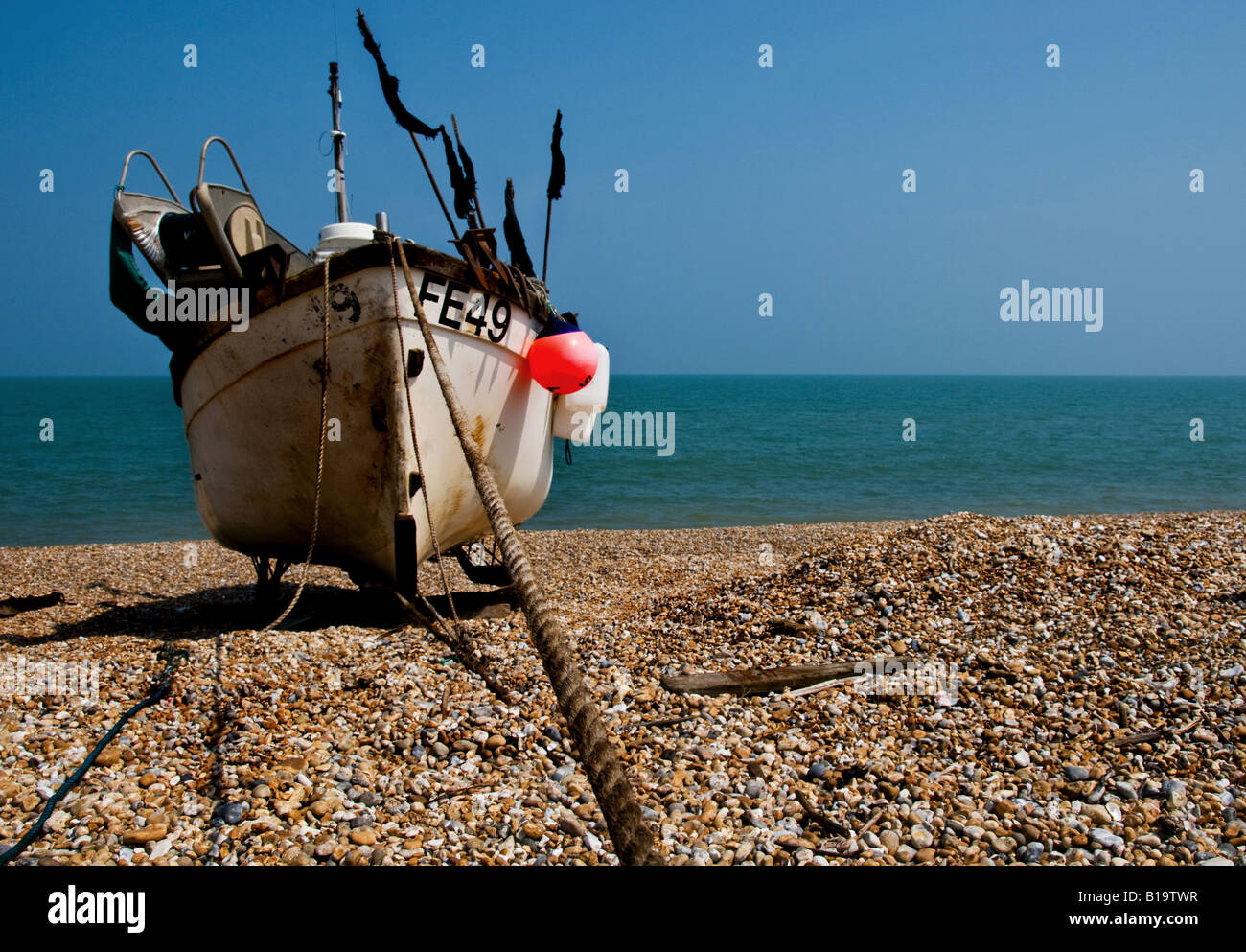 A fishing boat beached at Dungeness in Kent Stock Photo - Alamy