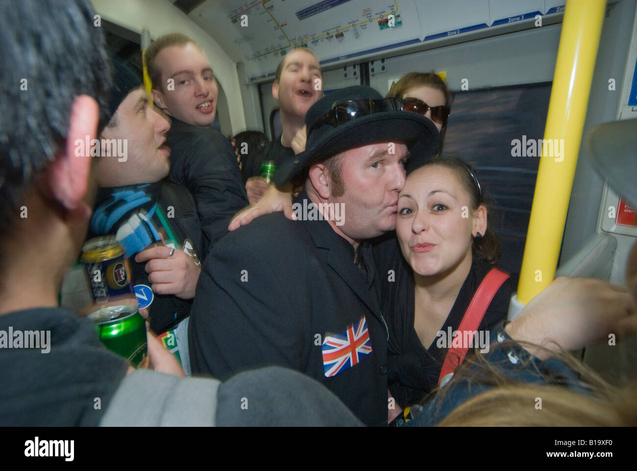 New Zealanders partying in an underground train carriage during the Waitangi Day Circle Line pub crawl, London Stock Photo